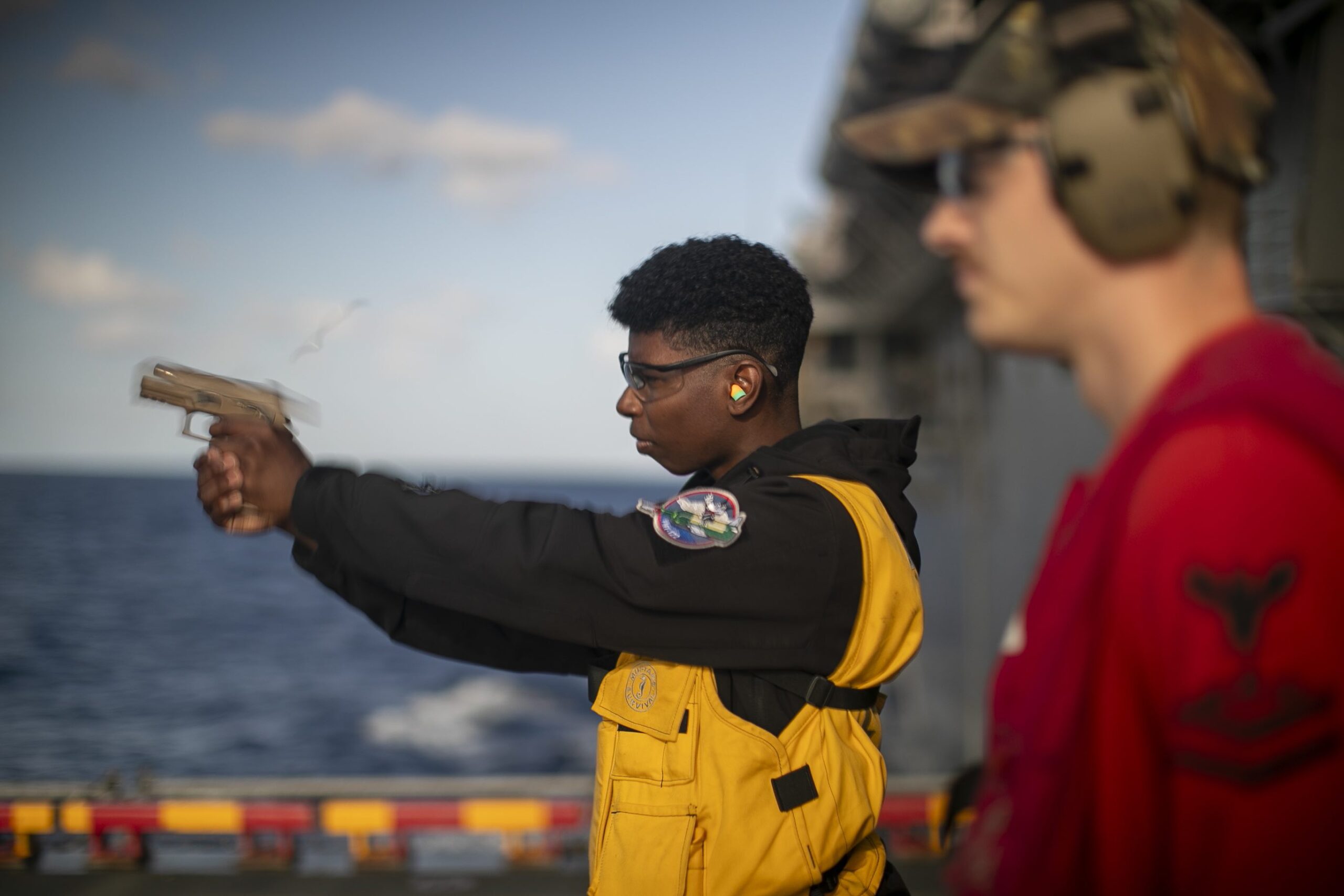 San Antonio native participates in a small arms qualification aboard USS Tripoli